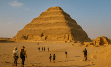 Step Pyramid of Saqqara with visitors exploring the ancient pyramid complex in Egypt