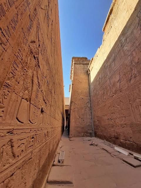 Preserved outer walls and passage of Edfu Temple in Upper Egypt.
