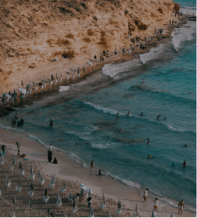 Aerial view of Agiba Beach in Marsa Matrouh with crystal-clear turquoise Mediterranean water.