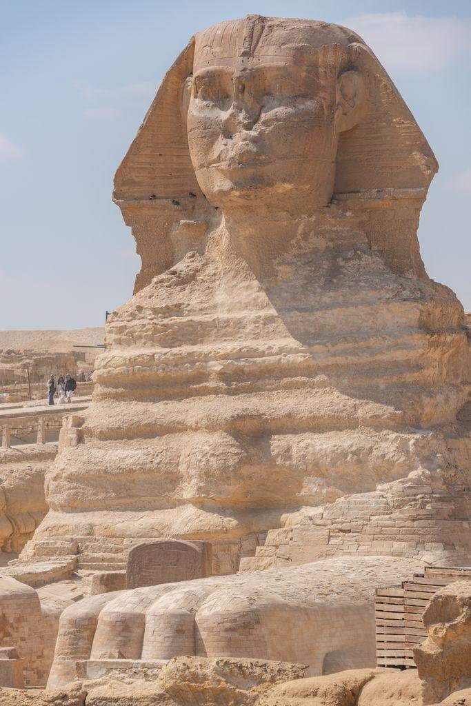Iconic Sphinx statue in Giza, Egypt captured under a clear blue sky.