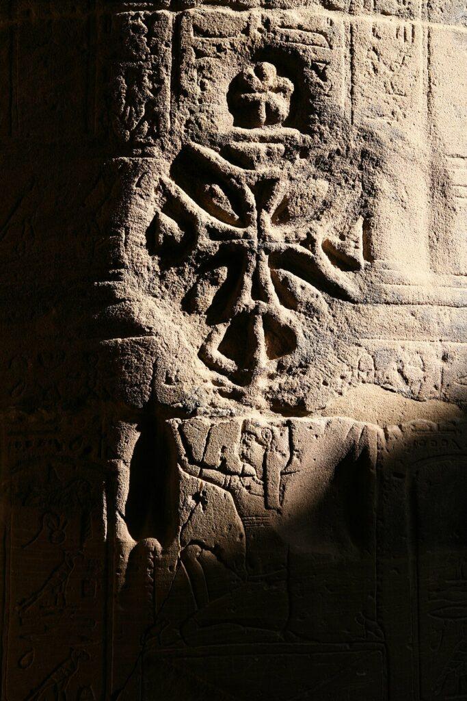 Christian cross carved over an ancient Egyptian relief at the Temple of Isis at Philae