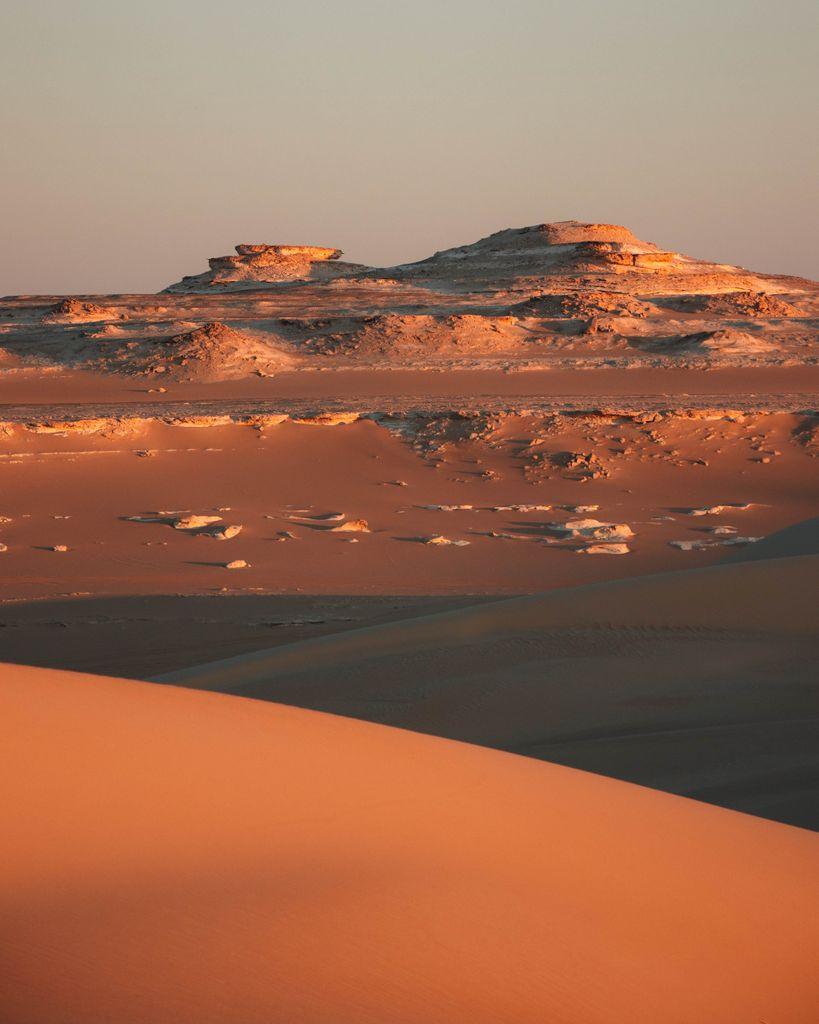 Captivating sunset scene of arid sand dunes at Siwa Oasis, Egypt.