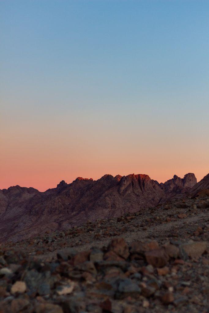 Scenic view of Mount Sinai's rugged peaks at sunrise, capturing the natural beauty of the South Sinai landscape.