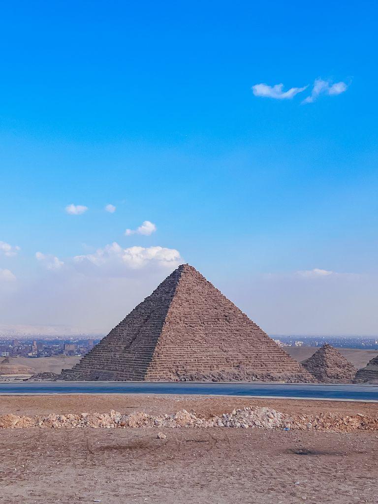 Stunning view of the Great Pyramid of Giza, captured outdoors under a clear blue sky in Egypt.